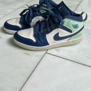 Nike Air Jordan’s Blue, Teal and White High-Top Sneakers